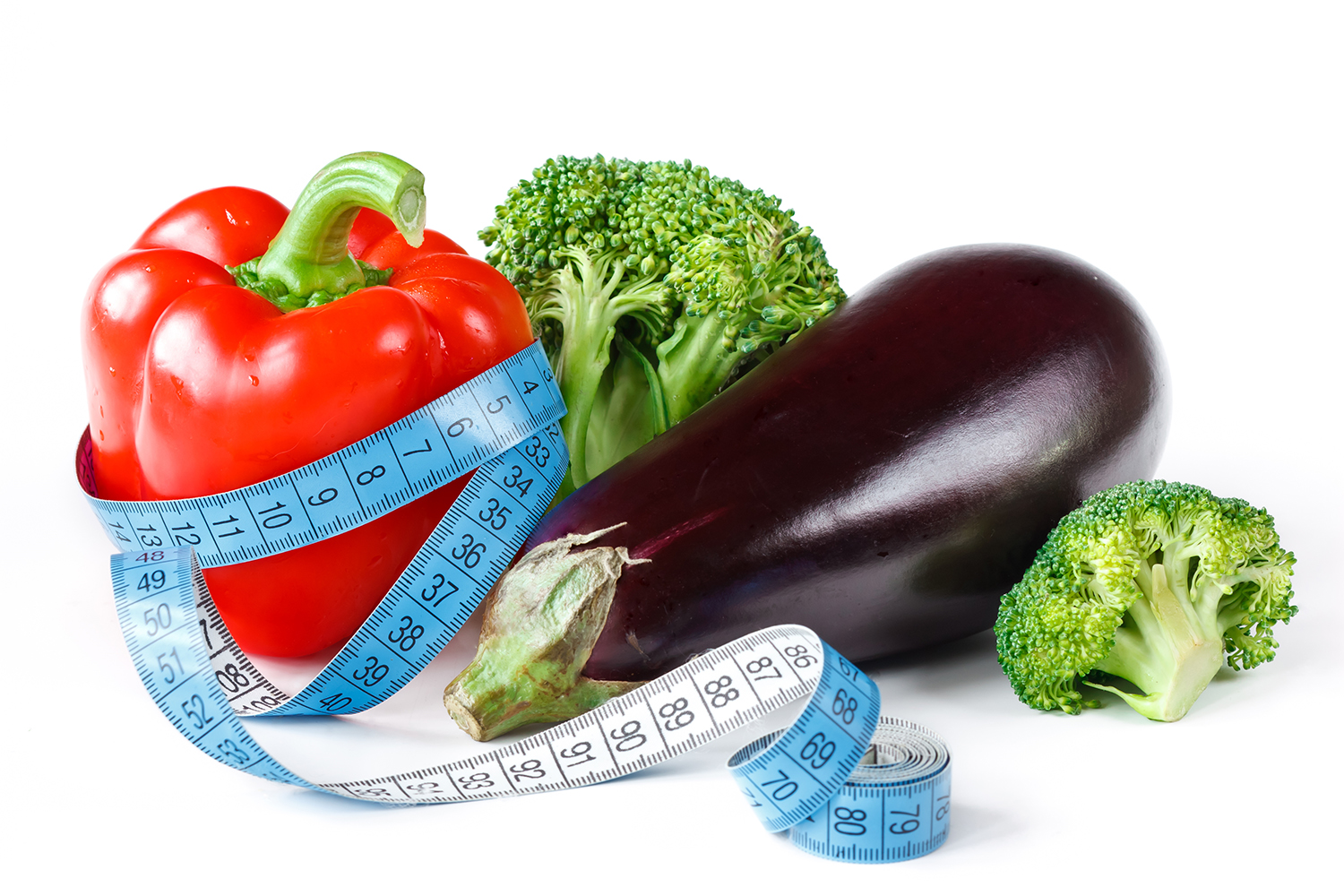 Grøntsager med et målebånd omkring
