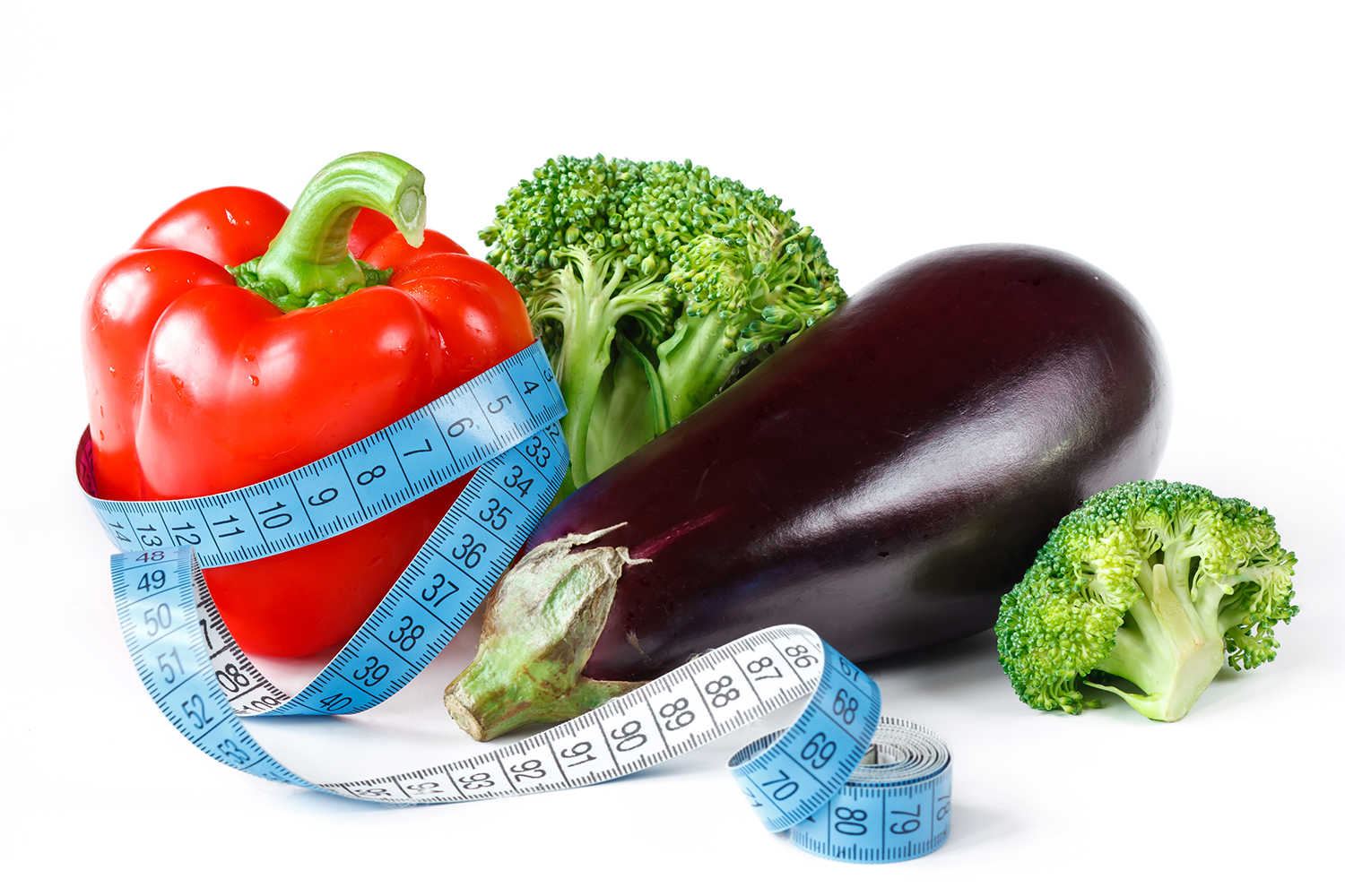 Grøntsager med et målebånd omkring